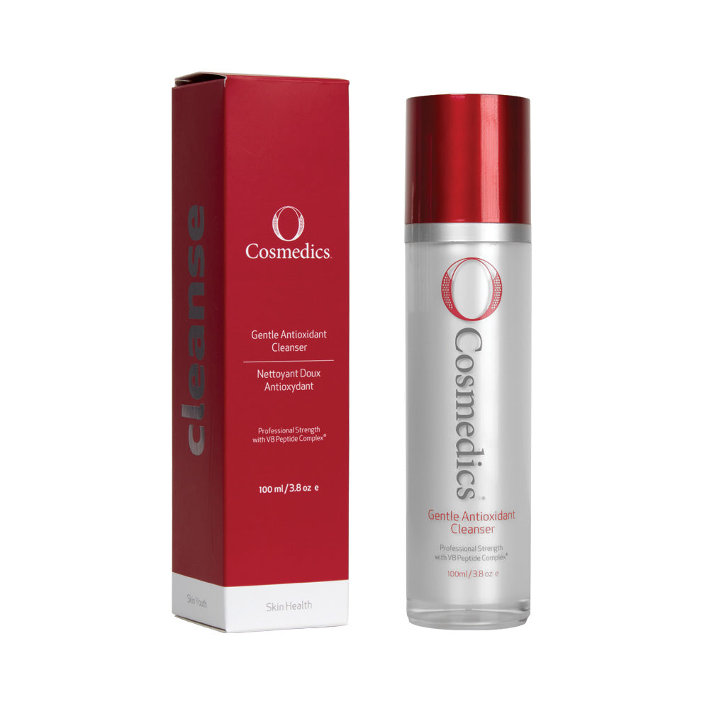 o cosmedics gentle antioxidant cleanser in grey container with red lid next to red packaging box in front of white background