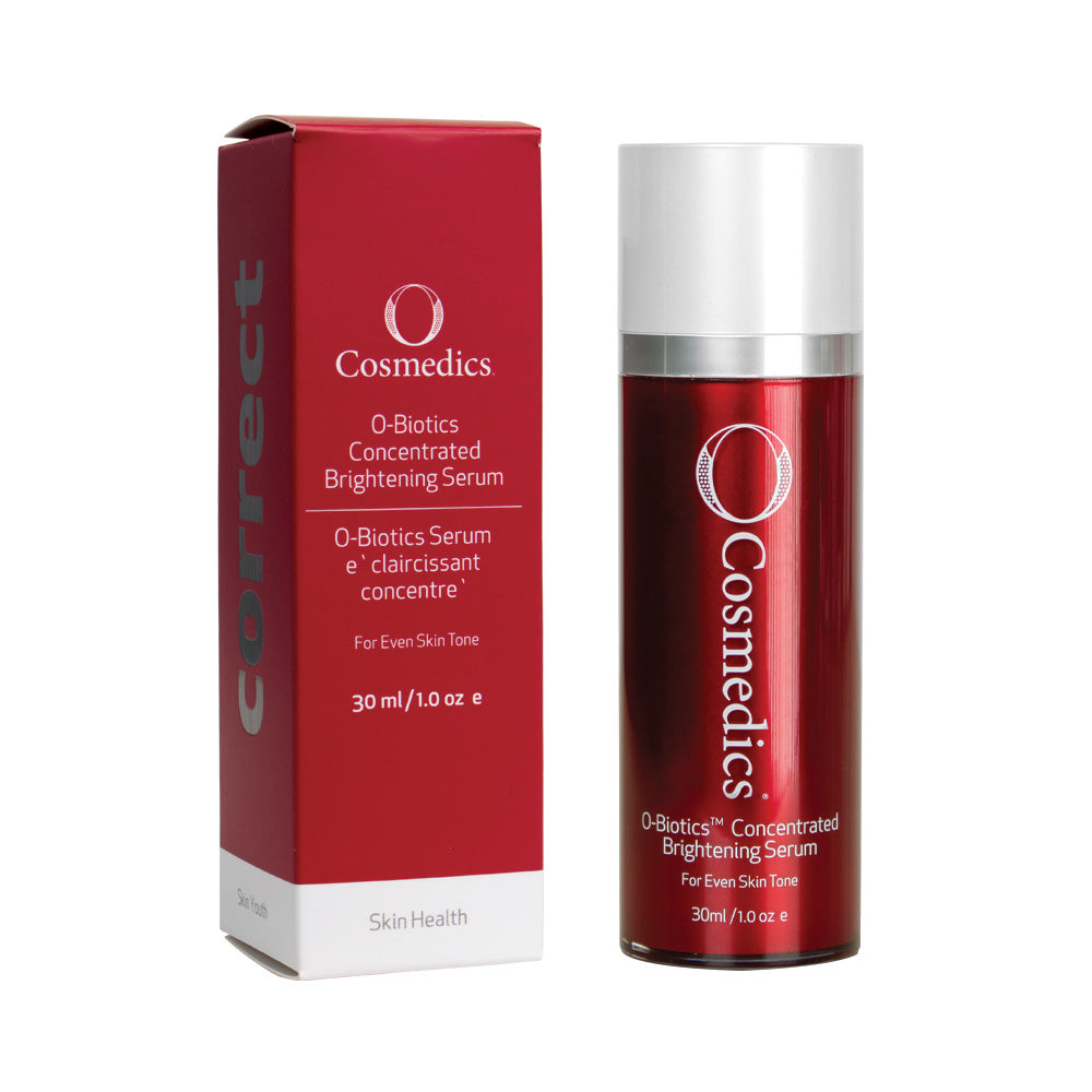 O Cosmedics concentrated brightening serum in red container with white lid next to red packaging in front of white background