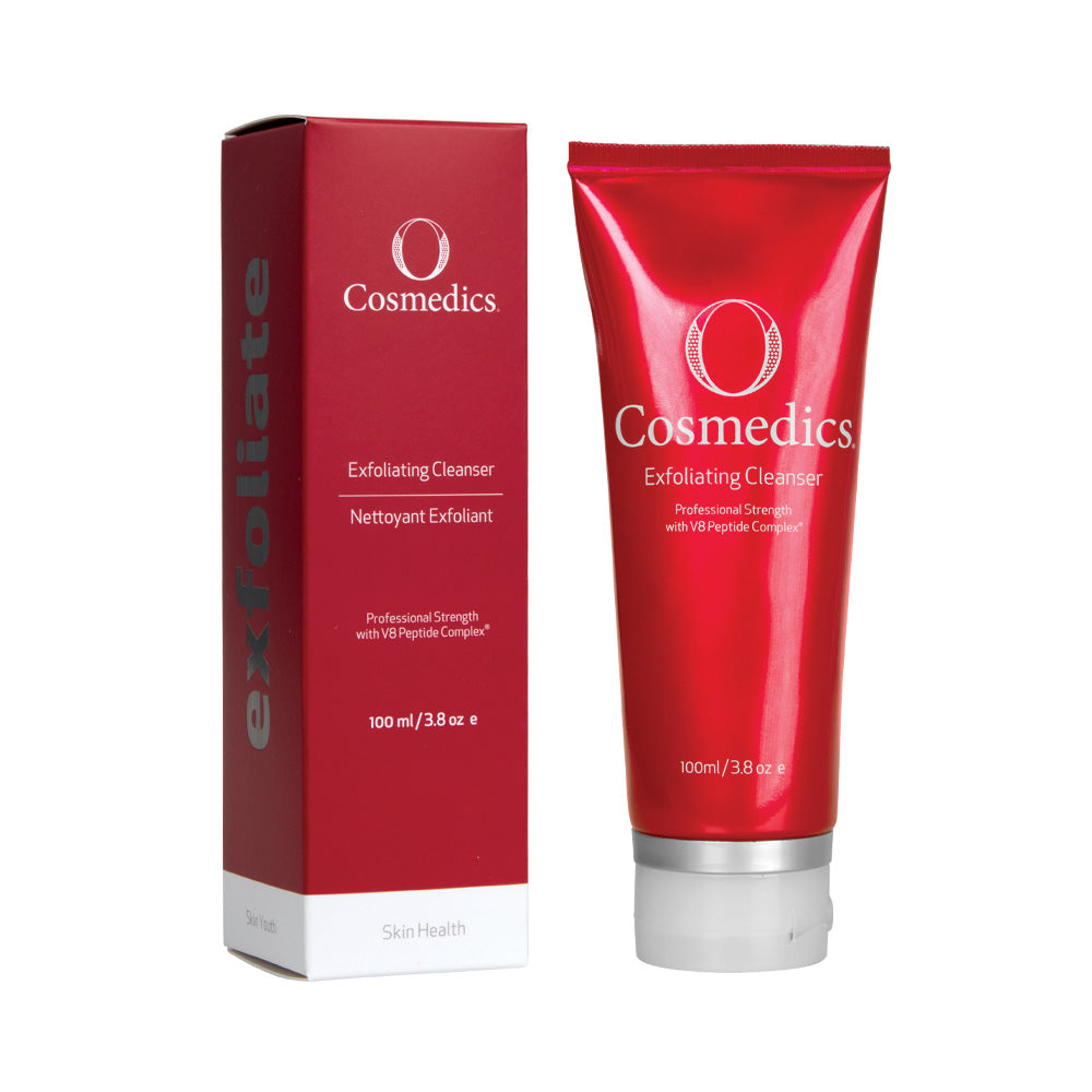 O Cosmedics exfoliating cleanser in red container with white lid next to red packaging box in front of white background