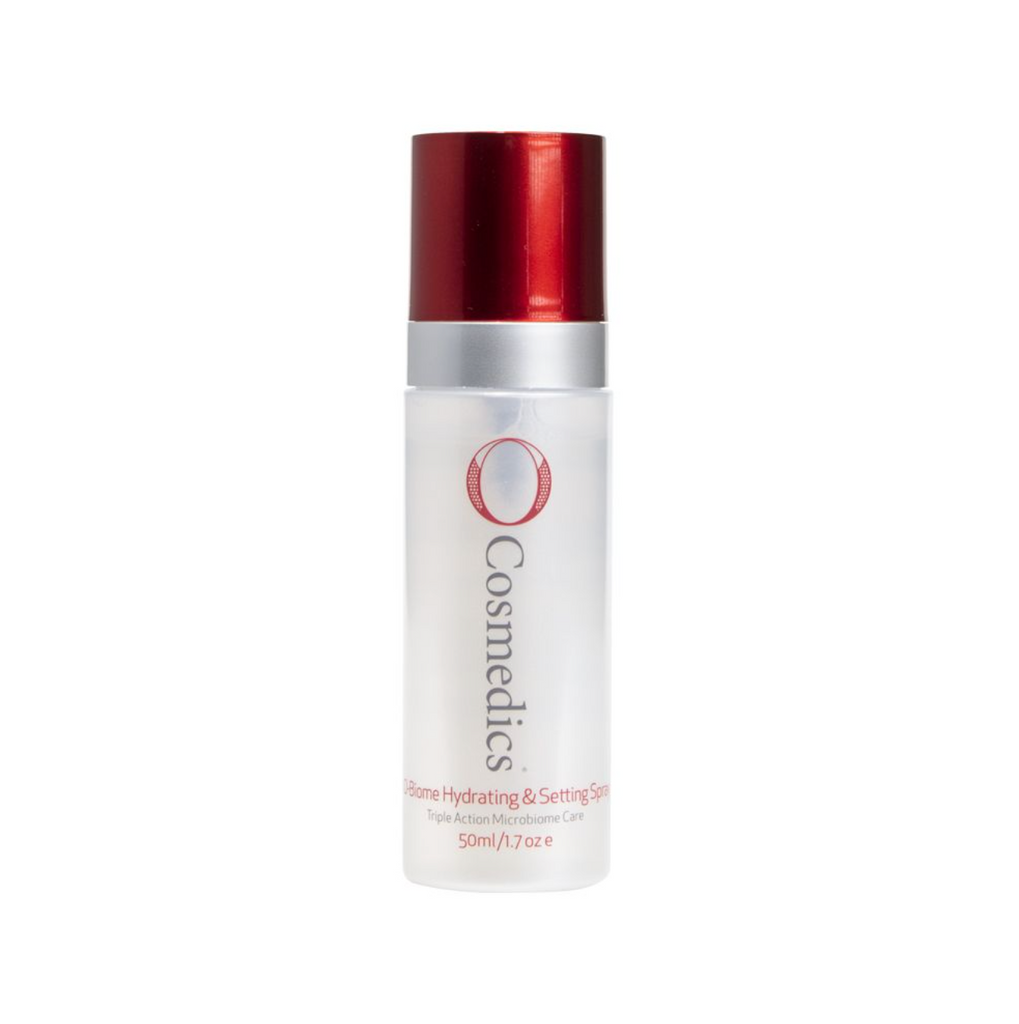 O Cosmedics O-biome hydrating and setting spray in white bottle with red lid in front of white background