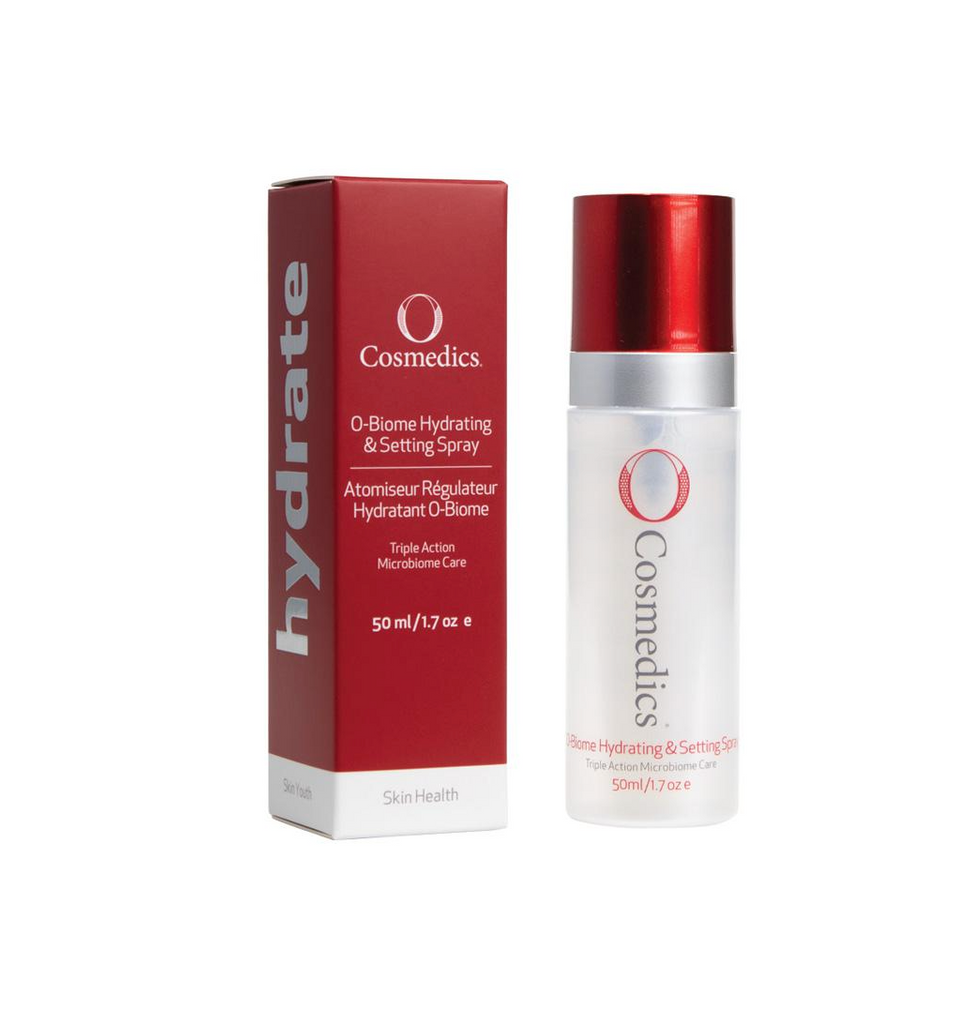 O Cosmedics O-biome hydrating and setting spray in white bottle with red lid next to red packing box in front of white background