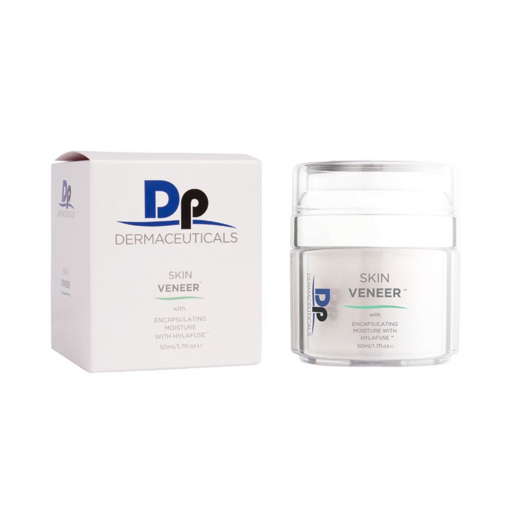 DP dermaceuticals skin veneer in transparent container with transparent lid next to white packaging box in front of white background