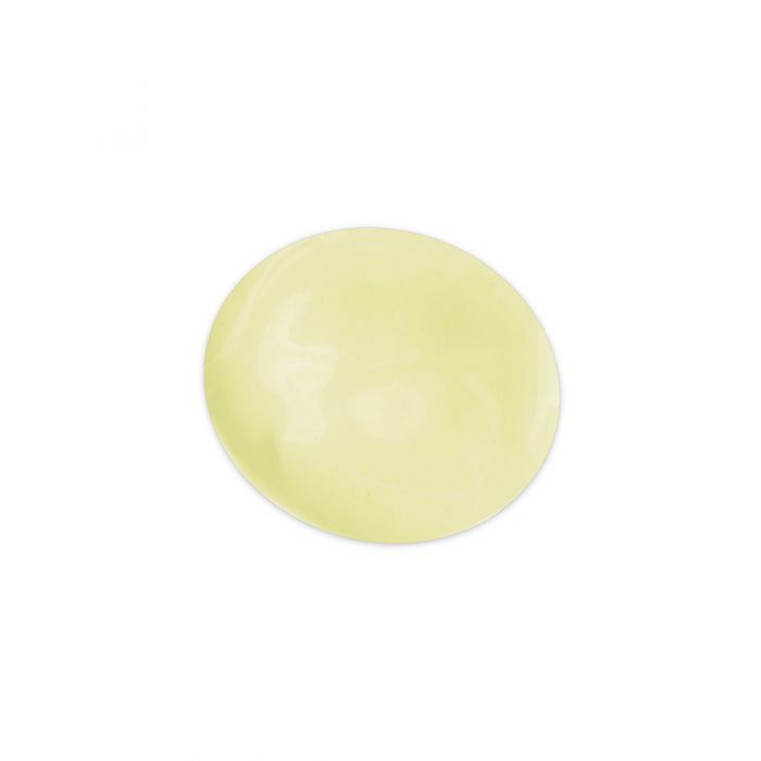 pale yellow globule of substance on a white surface