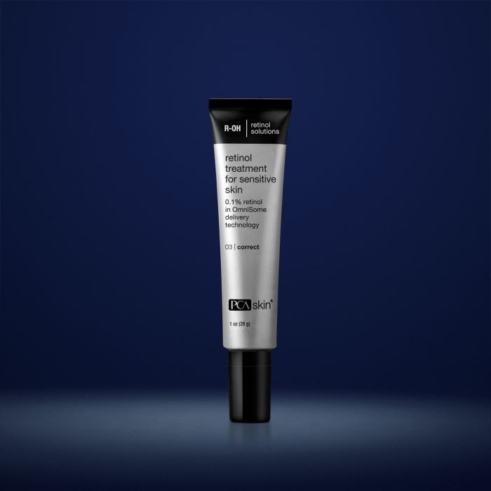 PCA Skin retinol treatment for sensitive skin in silver container with black lid in front of dark blue background